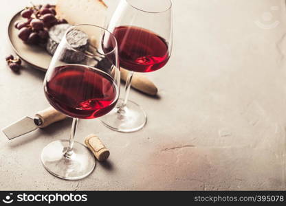Red wine and cheese on concrete background. Red wine and cheese on concrete background, copyspace