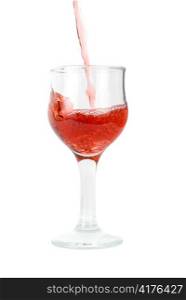 Red wine being poured into a wine glass isolated on white