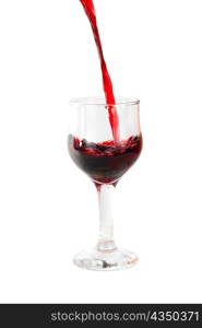 Red wine being poured into a wine glass isolated on white