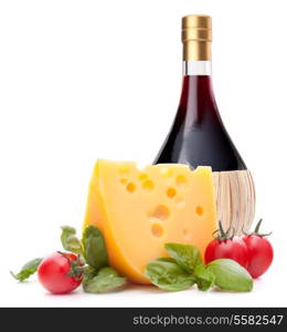 Red wine bottle, cheese and tomato still life isolated on white background cutout. Italian food concept.