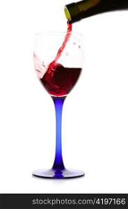 Red wine flowing from a green bottle to a glass.Isolated on white