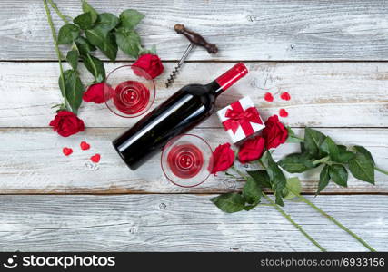 Red wine for Valentines Day on rustic white wood