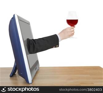 red wine glass in businessman hand leans out TV screen isolated on white background