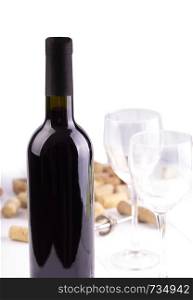Red wine glasses, bottle and corks. Isolated on white background