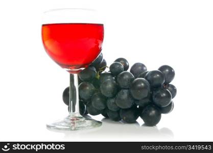 Red wine in glass with grape on white background