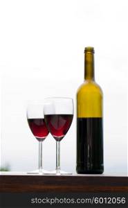Red wine in glasses with bottle, outdoor
