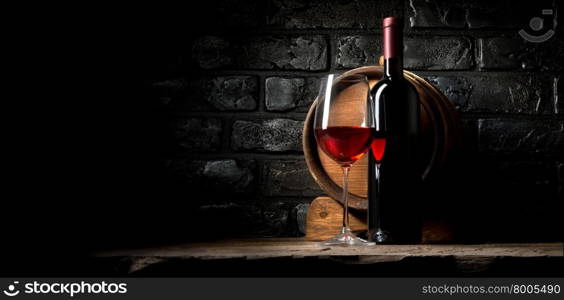 Red wine on a background of old black bricks