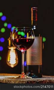 Red wine on a background of vintage lamps. Red wine and lamps