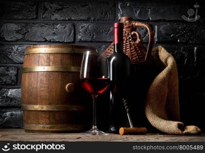 Red wine on a wooden table in cellar
