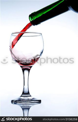 Red wine pour in a glass
