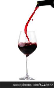 Red wine pouring from bottle into glass isolated on white background. Red wine pouring