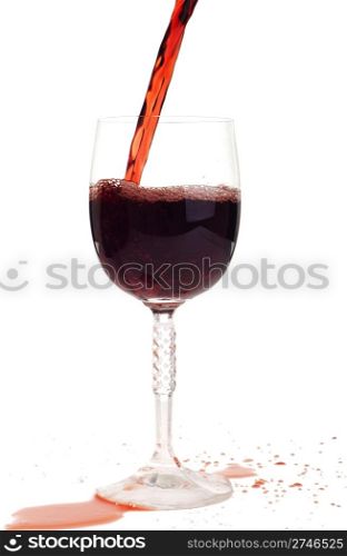 red wine pouring into a crystal glass (isolated on white background)