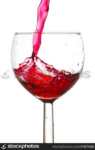 red wine pouring into glass. isolated on white background