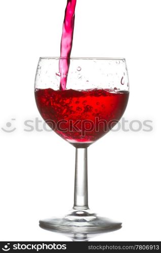 red wine pouring into glass over a white background