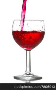 red wine pouring into glass over a white background