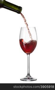 Red wine pouring into glass with splash isolated on white