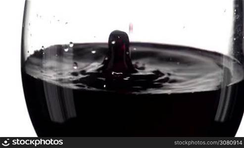 Red wine pouring, slow motion