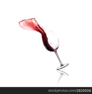 red wine splashing out of a glass, isolated on white