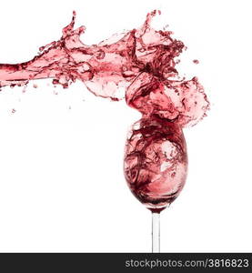 red wine splashing out of a glass, isolated on white