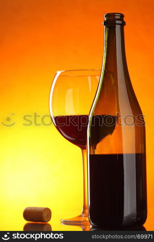 Red wine - still-life with glass, bottle and cork