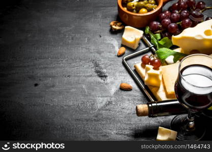 Red wine with a fragrant cheese , olives and almonds.. Red wine with fragrant cheese , olives and almonds.