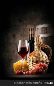 Red wine with grapes and cheese on brown background. Red wine with grapes and cheese