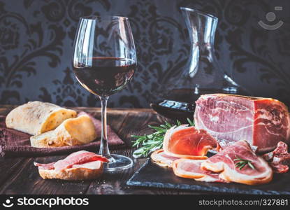 Red wine with prosciutto ham