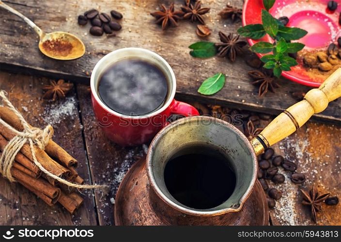 Red with warming Cup of coffee,turk and spices.