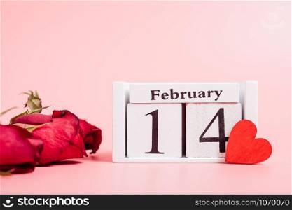Red wood Hearts and gift box on pink background, 14 February, valentine day concept