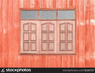 Red Wooden window of countryside house.