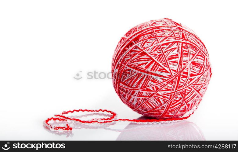 Red wool yarn ball isolated on white background