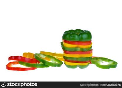 Red, yellow and green bell pepper slices isolated on the white background
