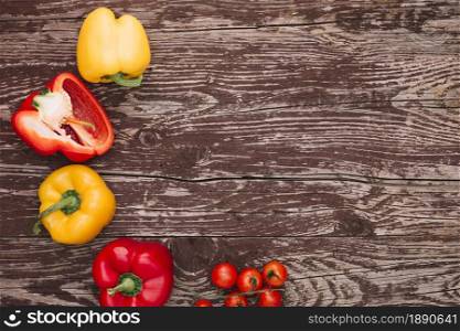 red yellow bell peppers cherry tomatoes wooden desk . Resolution and high quality beautiful photo. red yellow bell peppers cherry tomatoes wooden desk . High quality and resolution beautiful photo concept