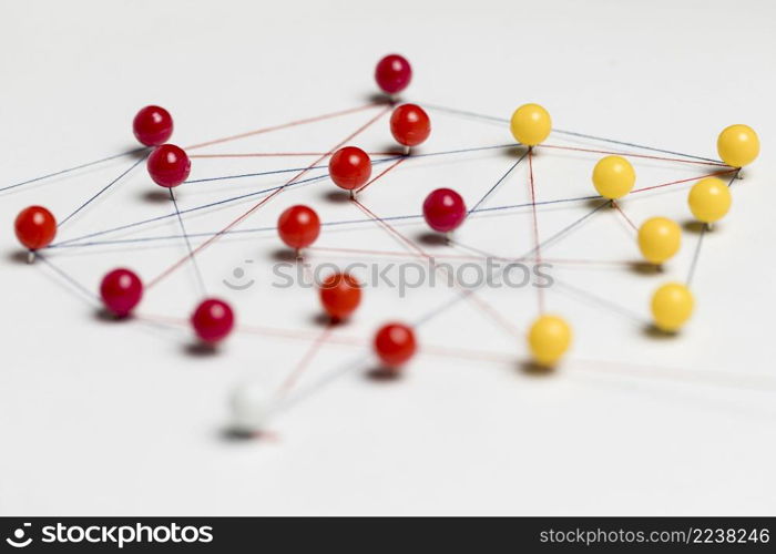 red yellow pushpins with thread route map