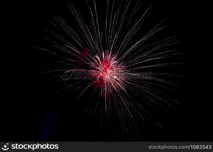 Red Yellow Sparkling Fireworks Background on Night Scene. Abstract color fireworks background and smoke on sky