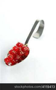 Redcurrant in a spoon