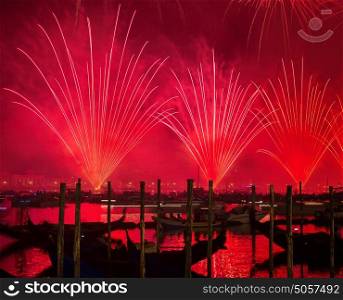 Redentore holiday, Redeemer festival of fireworks, beautiful red salute over water, traditional celebration, tourism and travel to Venice, Italy