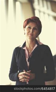 redhair senior business woman portrait at corporate office interior