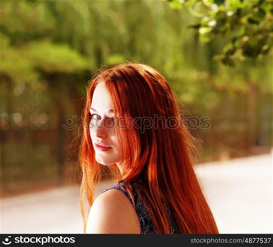 Redhair woman looking back toned shot