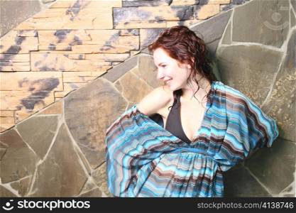 redhead brown eyes beautiful girl standing by stone wall