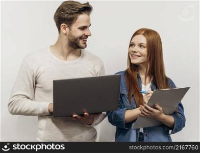redhead businesswoman working laptop with her coworker
