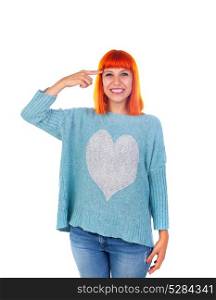 Redhead girl with blue jersey doing a signal of crazy with her finger isolated on white background