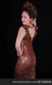Redhead in a copper colored sequined gown