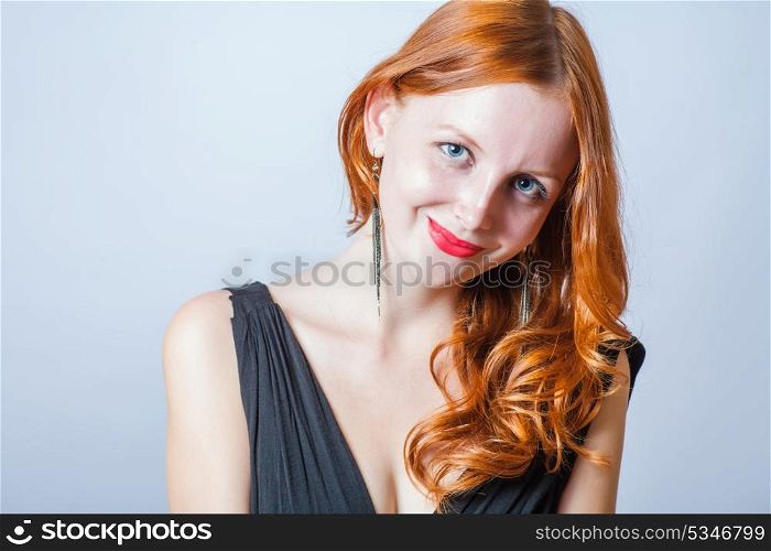 redhead in studio smiling