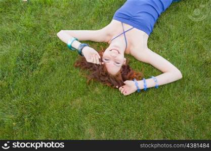 redhead lay on grass