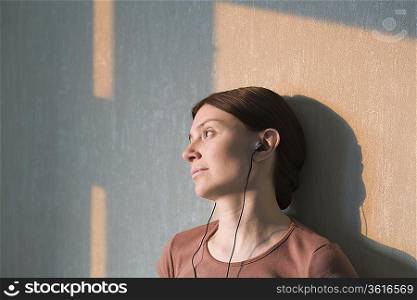 Redhead listens to headphones