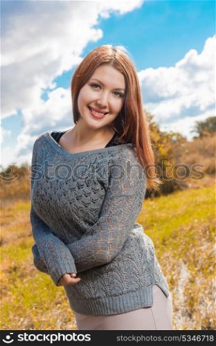 redhead weared gray sweater outdoors at autumn