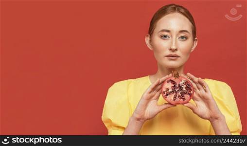 redhead woman holding pomegranate 5