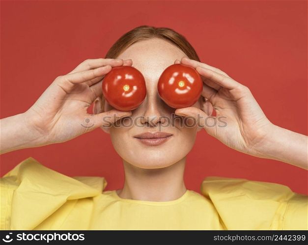 redhead woman holding tomatoes 2