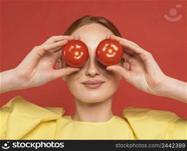 redhead woman holding tomatoes 2